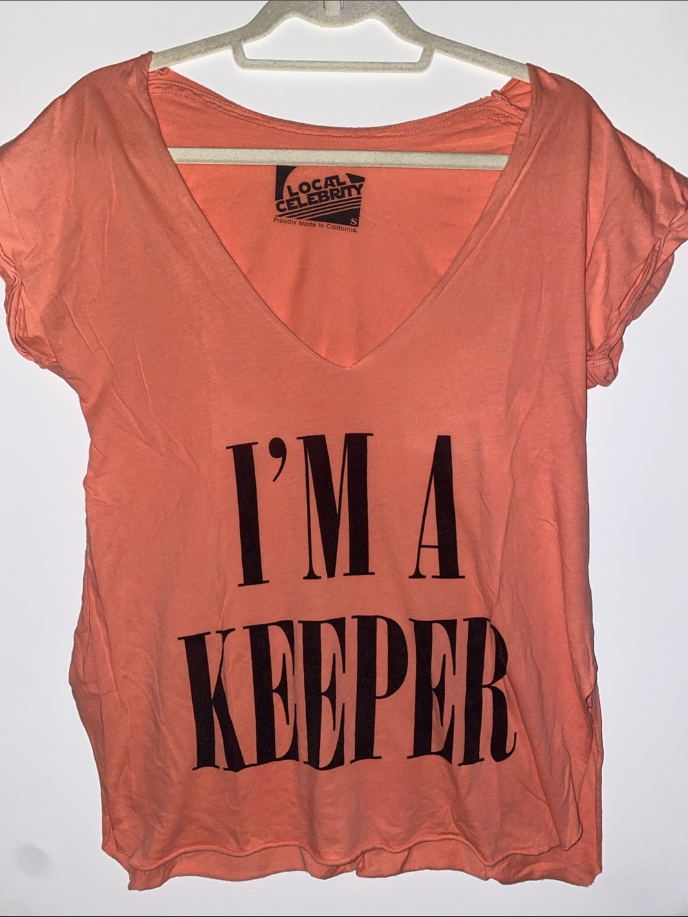 Local Celebrity: Women's Coral V-Neck Graphic Tee - "I'm A Keeper"